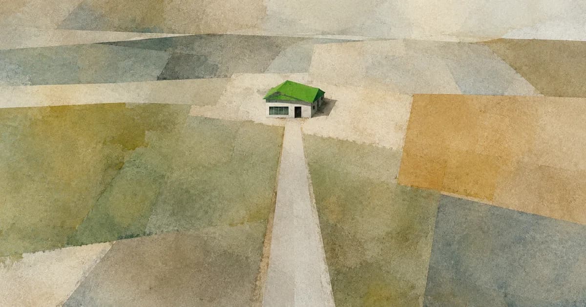 A single empty road crossing empty fields to one small building: a website not getting traffic or visitors.